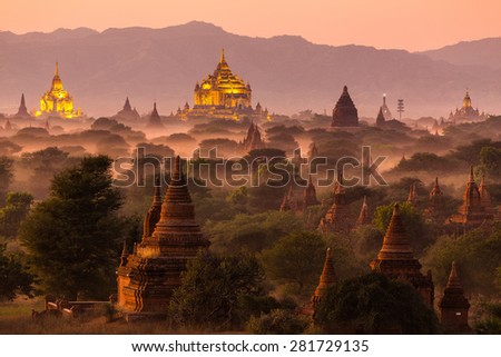 Pagoda landscape under a warm sunset in the plain of Bagan, Myanmar (Burma) Royalty-Free Stock Photo #281729135