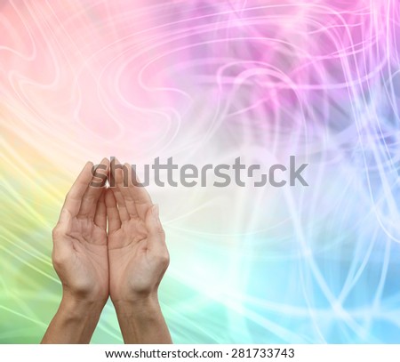 Rainbow Healing Reiki Share Message Board - Female cupped hands on subtle swirling rainbow energy formation background with plenty of copy space above and to the right 
