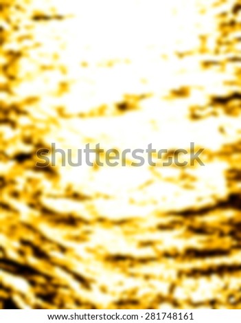 Blurry and bokeh background of water on the ocean with golden color of sunset time
