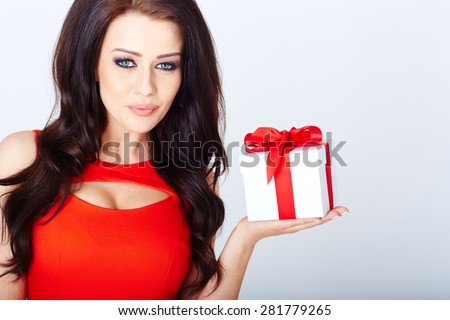 Fashion photo of luxury brunett with a gift