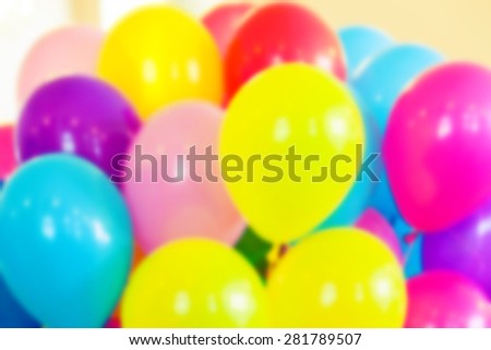 Group of colorful balloons, blurred photo background with vintage tonal photo filter effect, instagram retro style