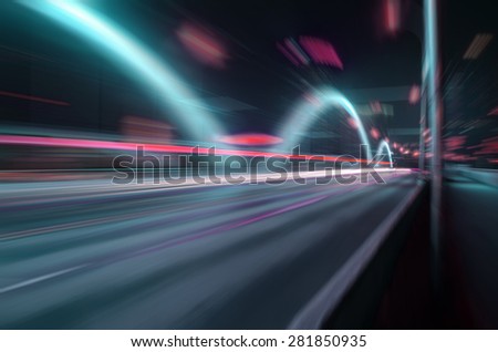 Fast-moving traffic on the bridge at night