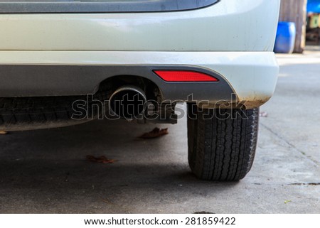 Close up of exhaust pots of white car