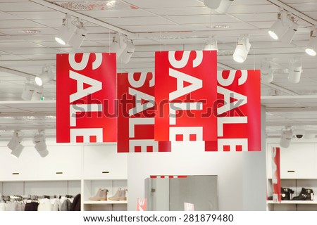 Sale signs in a clothing store.