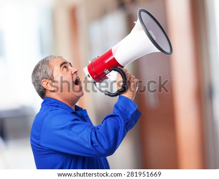 portrait of a mechanic shouting with a megaphone