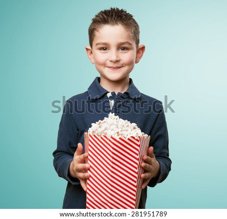 little kid eating popcorn