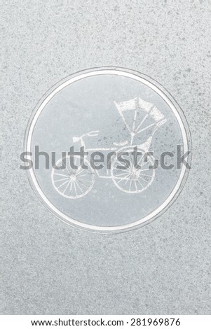 Tricycle vehicle parking sign on granite texture background