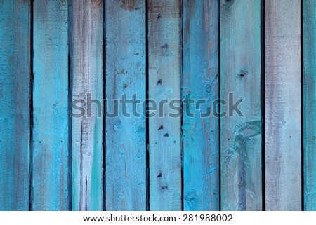 Weathered blue wall made of wood 