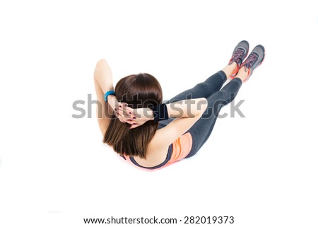 Fitness woman doing abdominal exercises isolated on a white background
