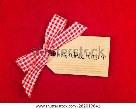 red greeting card background with cute bow - german for feast of corpus christi