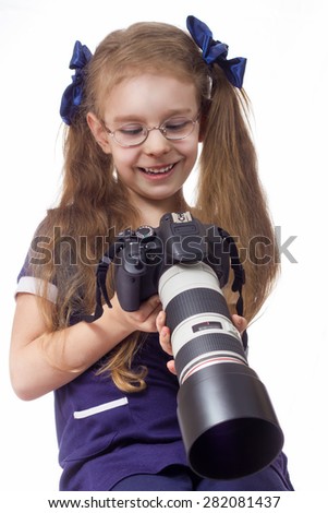girl with a camera in glasses isolated white background