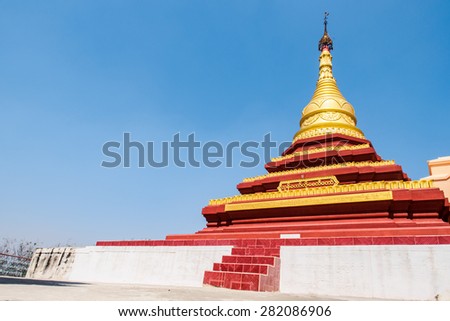 Golden pagoda on blue sky background on Mandalay Hill, Myanmar