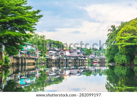 Land scape photo of Old Town Chanthaboon Waterfront and reflection in water famous tourist attractions with filter effect, Chanthaburi, Thailand. 