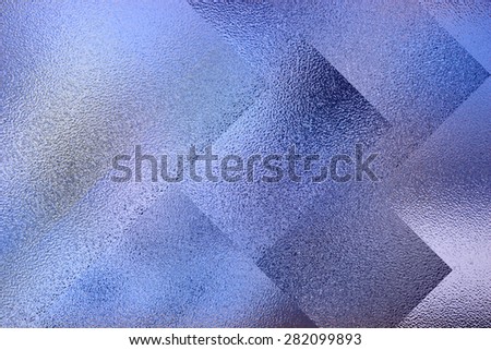 Frosted glass texture. Colorful lights background. Geometric background.