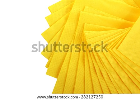 Yellow Serving colored paper napkins isolated