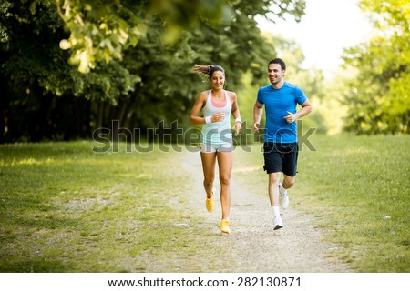 Young couple running Royalty-Free Stock Photo #282130871