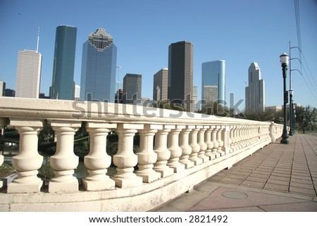 Downtown Houston viewed from a bridge sidewalk over the bayou