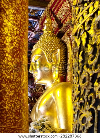Golden Buddha image in temple of  Wat Phumin in Nan, Thailand