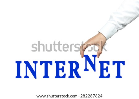 Businessman is holding the text of Internet isolated on white background.