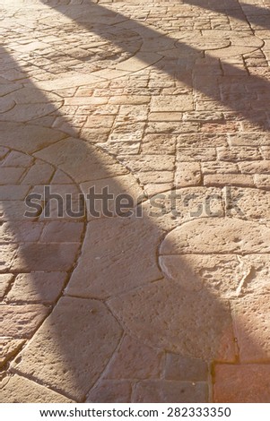 Shadows Cast From Pillars on Ancient Stone Floor 