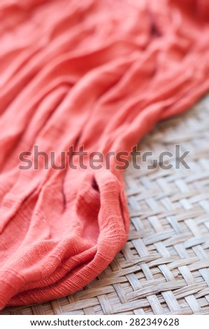 orange napkin on wooden table