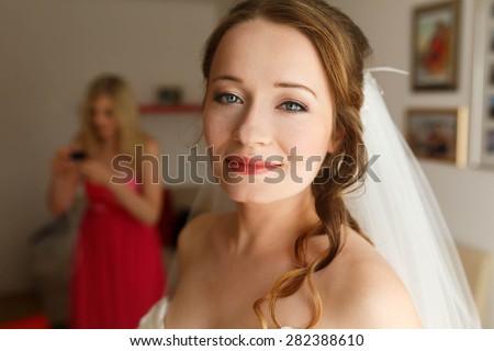 happy cute stylish bride is posing and smiling