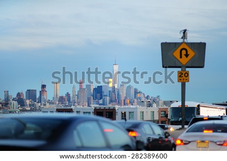 New York City traffic in rush hour with downtown skyline 