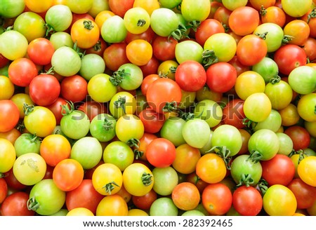 Background of local tomatoes for sale at a market,Healthy tomatoes background 