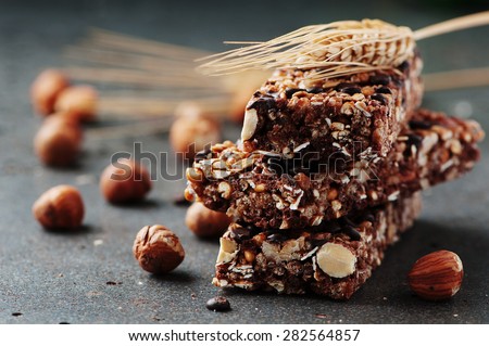 Cereal bar with nuts and chocolate, selective focus Royalty-Free Stock Photo #282564857