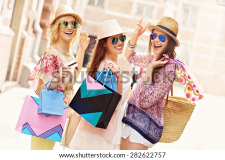 A picture of a group of happy friends shopping in the city Royalty-Free Stock Photo #282622757