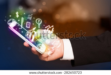 Smartphone with finance and market icons and symbols concept