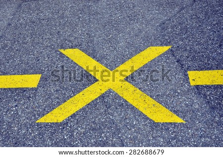 No parking yellow cross line symbol on the road