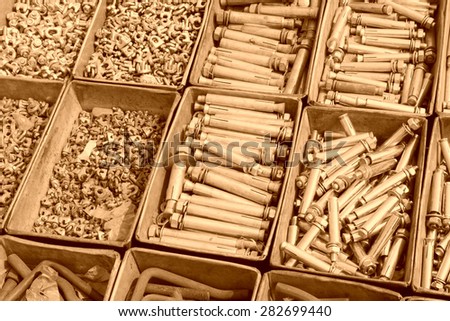 metal parts and fasteners in a iron box, closeup of photo