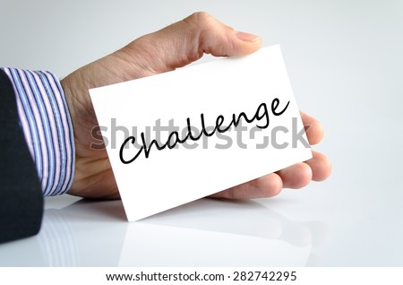 Challenge note in business man hand
