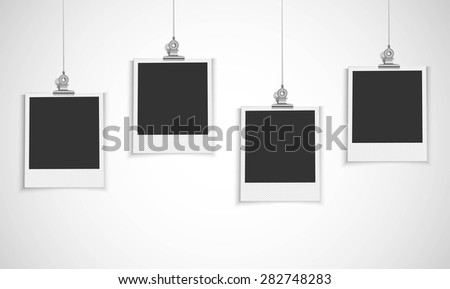 Blank photo frame hanging on a line with bulldog clip