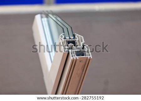 Cut of the window profile with metal, glass and insulation