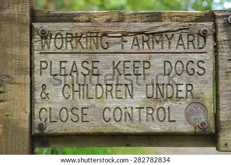"Working Farmyard, Please Keep Dogs and Children Under Close Control" Sign, Believer Forest, Dartmoor, Devon, England, UK