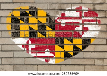 heart shaped flag in colors of maryland on brick wall