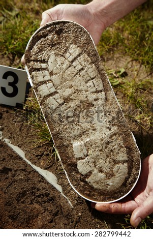 Crime scene investigation - evidence of footprint Royalty-Free Stock Photo #282799442