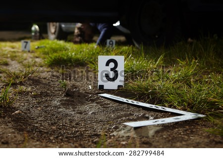 Crime scene investigation - footprint of murder on way Royalty-Free Stock Photo #282799484