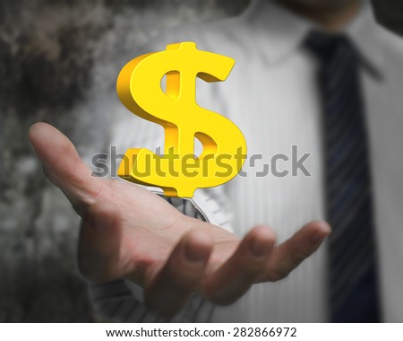 Golden dollar sign in the business man's hand
