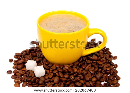 Yellow cup of coffee with beans isolated on white background