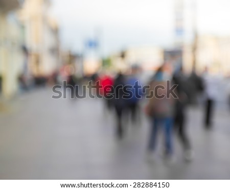 people walking on street in blur