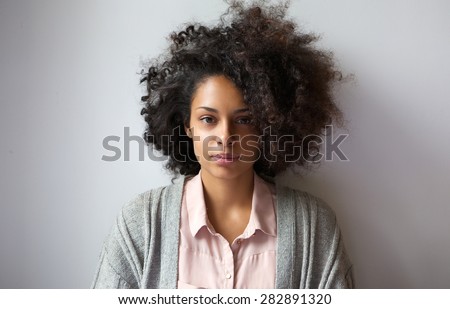 Close up portrait of a beautiful young woman with afro hairstyle Royalty-Free Stock Photo #282891320