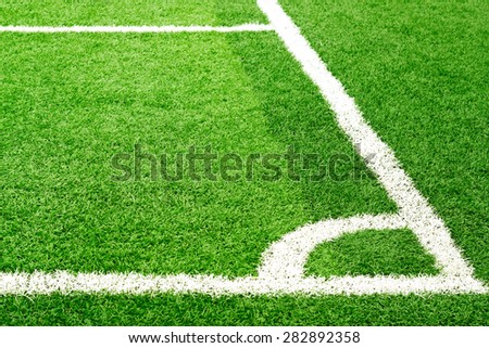 Green soccer field grass and white corner line