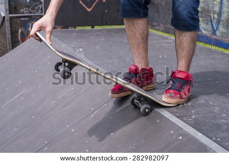 Close up of skateboarder at skate park