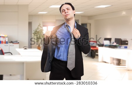  Sweating businessman due to hot climate Royalty-Free Stock Photo #283010336