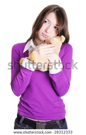 portrait of a beautiful girl with a teddy bear in hands
