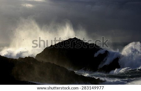 Giant waves breaking on the shore, cape A Frouxeira, A Coruna, Galicia, Spain, temporary sea coast, storm at sea, cliffs, foam, ocean, clouds,