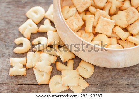 Alphabet biscuit in wooden tray, stock photo